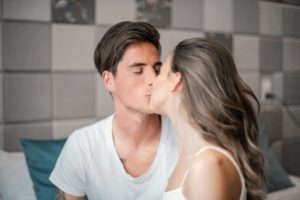 couple kissing - dating coach