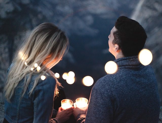 couple on date at night with candles - dating advice for men