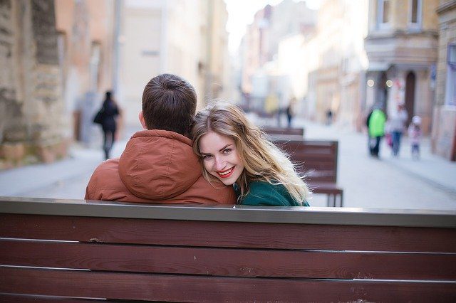 Woman with man on park bench